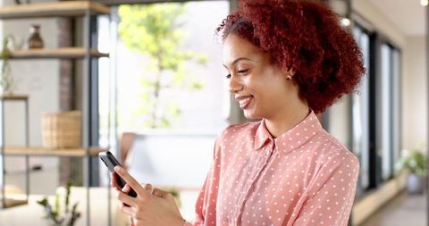 Professional Woman in Office Using Smartphone Connection Technology