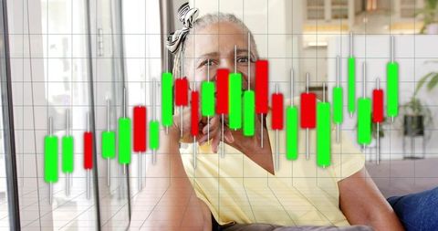 Mature woman relaxing on couch, stock market candlestick overlay for retirement investing