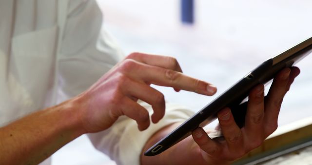 Man Using Tablet Close-Up for Digital Interaction and Communication - Download Free Stock Images Pikwizard.com