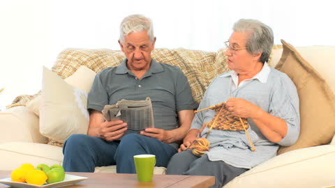 Elderly Couple Relaxing Together at Home