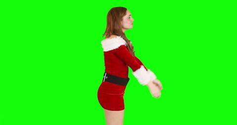 Festive Woman in Santa Outfit on Green Screen for Holiday Projects