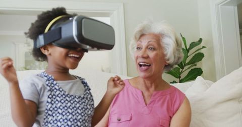 Grandmother and Granddaughter Enjoying Virtual Reality Together