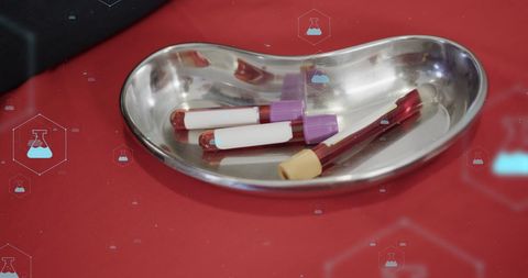 Blood test tubes with digital medical icons overlay