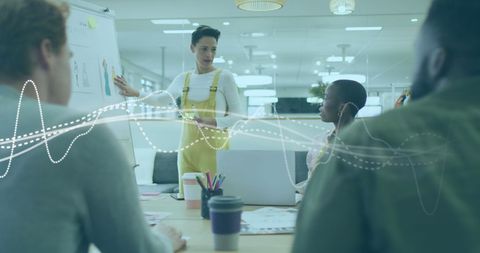 Diverse Coworkers Analyzing Financial Graph in Modern Office