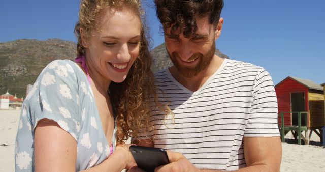 Happy Young Couple Using Smartphone at Beach - Download Free Stock Images Pikwizard.com