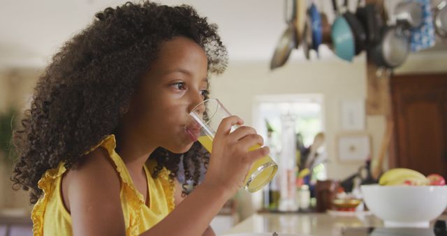 Young Girl Drinking Fresh Juice in Kitchen - Download Free Stock Images Pikwizard.com