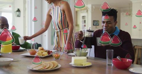 Couple enjoying breakfast with watermelon motif overlay