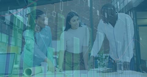 Diverse Team Collaborating on Business Strategy with Financial Graphs