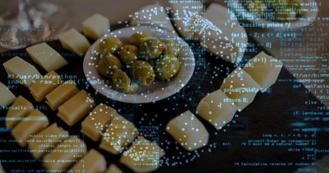 Gourmet olive and cheese platter with digital code overlay and blue bokeh lighting