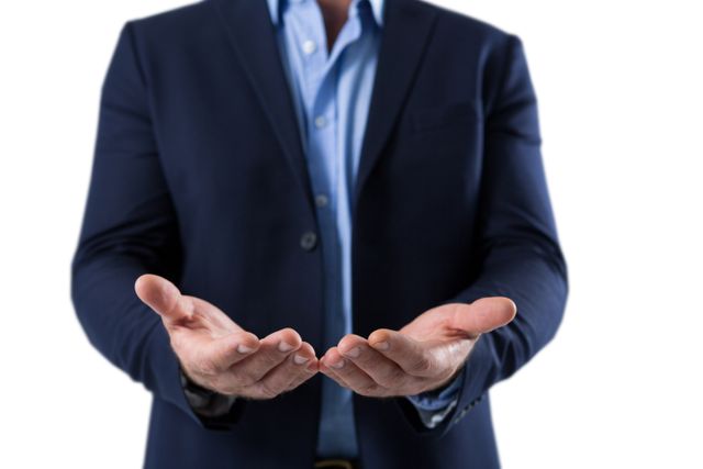 This image depicts a businessman in a blue suit showing his empty hands in a gesture of helplessness or uncertainty. It can be used in business presentations, articles about economic challenges, or corporate training materials to illustrate concepts of uncertainty, lack of resources, or seeking help.