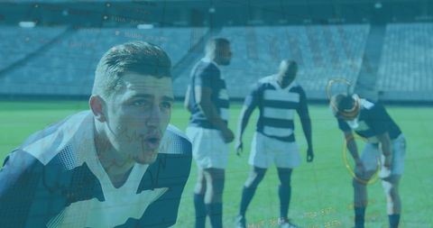 Rugby players analyzing data amidst stadium backdrop