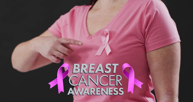 Woman Wearing Pink T-shirt Supporting Breast Cancer Awareness with Pink Ribbon - Download Free Stock Images Pikwizard.com