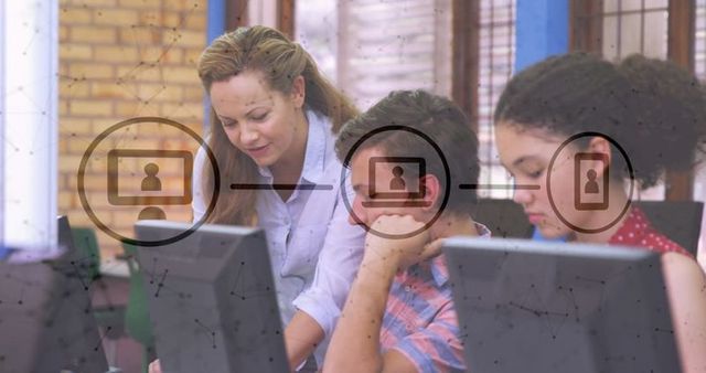 Teacher Guiding Students in Computer Lab with Digital Network Overlay