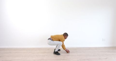 Young Boy Nailing Urban Dance Moves in Empty Room with Passion