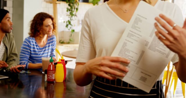 Restaurant Waitress Serving Customers Menu in Cafe - Download Free Stock Images Pikwizard.com