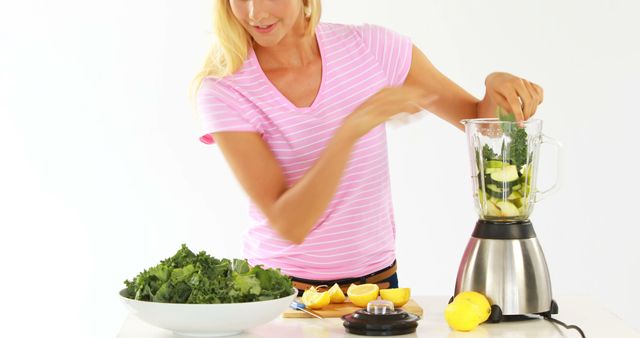 Woman Preparing Fresh Green Smoothie with Vegetables and Fruits - Download Free Stock Images Pikwizard.com