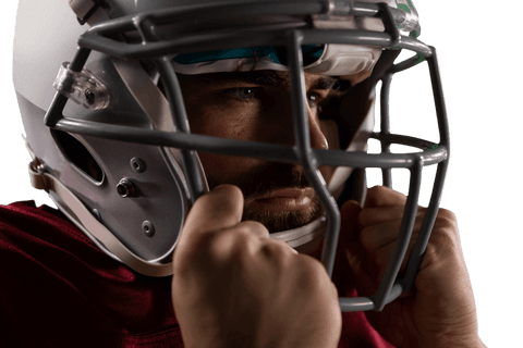 Focused hispanic rugby player in helmet on transparent background