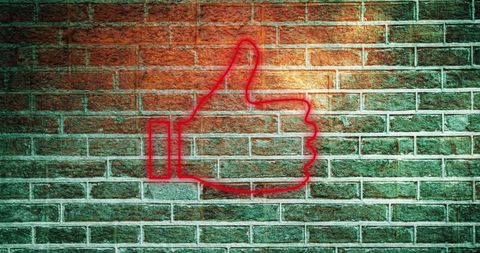 Glowing Neon Thumbs Up on Brick Wall - Download Free Stock Images Pikwizard.com
