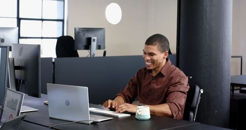 Cheerful Businesspeople Collaborating in Modern Office Workspace
