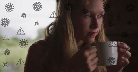 Cautious Coffee Break Amidst Pandemic Alert Symbols