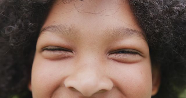 Close-up of Smiling Child with Curly Hair - Download Free Stock Images Pikwizard.com