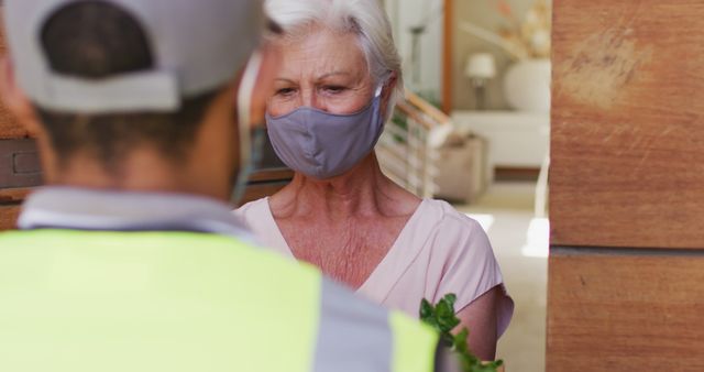 Senior Woman Receiving Delivery Wearing Mask - Download Free Stock Images Pikwizard.com