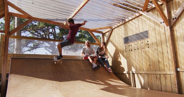 Teen skateboarding in wooden skatepark while friends watch. Scene of youth engaging in outdoor activities and enjoying summer leisure time. Perfect for illustrating themes of skateboarding culture, friendship, youth lifestyle, and recreational sports.