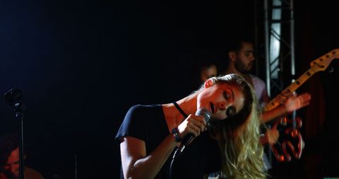 Young Female Singer Performing on Stage with Live Band - Download Free Stock Images Pikwizard.com