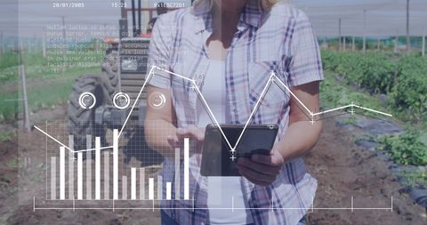 Businesswoman analyzing data in agricultural field