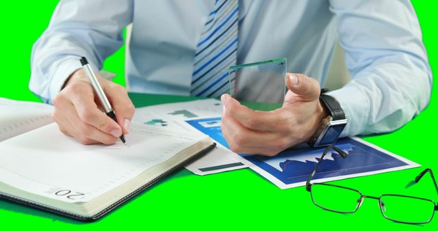 Businessman Analyzing Charts and Signing Documents at Desk - Download Free Stock Images Pikwizard.com