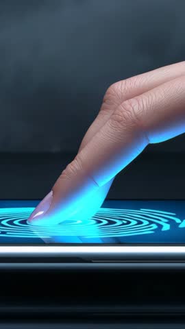 Vertical video showing pressing fingertip on smartphone fingerprint scanner in lab unlocking device