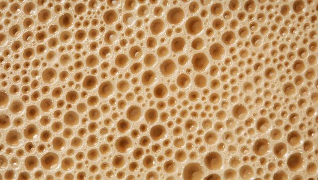 Macro Foam Bubble Texture Warm Beige Glossy Honeycomb Pattern for Backgrounds and Design