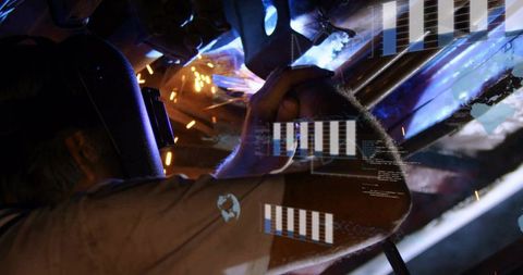 Welding mature welder using AR overlays while fabricating steel beams in industrial shop