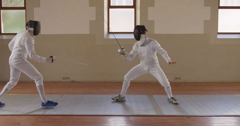 Two Male Fencers in Action Posing with Foils - Download Free Stock Images Pikwizard.com
