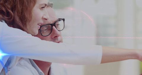 Focused Team Analyzing Data with Digital Interface Overlay