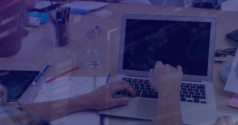 Professional Typing with Laptop in Casual Open Plan Office Workspace