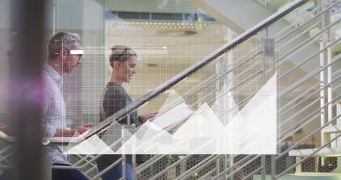 Business Professionals Analyzing Financial Data on Digital Media