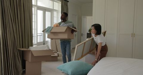 Couple Unpacking in New Home With Energetic Vibe