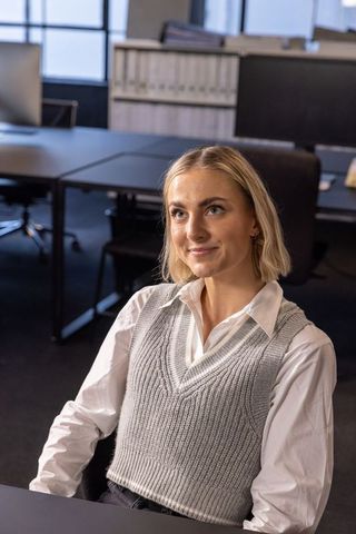 Professional Woman Working in Open-Plan Office Environment