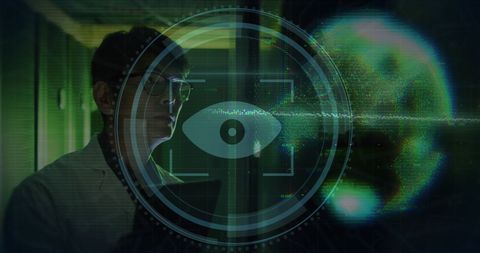 Asian IT Technician Analyzing Data on Computer Servers