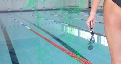 Swimmer Holding Goggles Poolside Ready for Lap Training and Focused Preparation