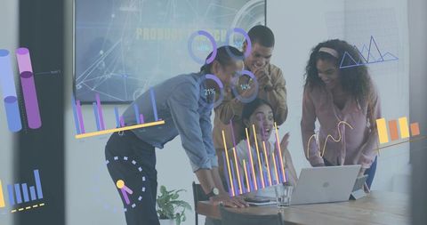 Diverse business team collaborating around laptop analyzing colorful data charts and graphs