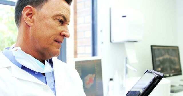 Doctor examining medical data on tablet in modern clinic - Download Free Stock Images Pikwizard.com