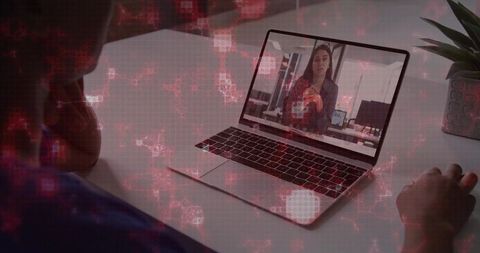 Remote team meeting with presenter on laptop and red cyber overlay for cybersecurity