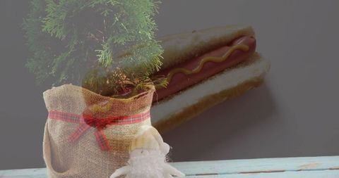 Whimsical burlap sapling and gnome with hot dog background