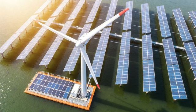 Floating wind turbine platform generating renewable power with integrated solar arrays