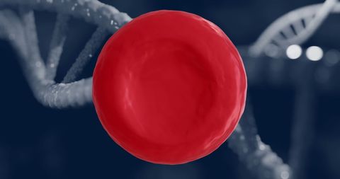 Close-up of red blood cell with dna strands on dark background