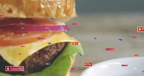 Cheeseburger with Digital Subscribe Play Signs on Counter