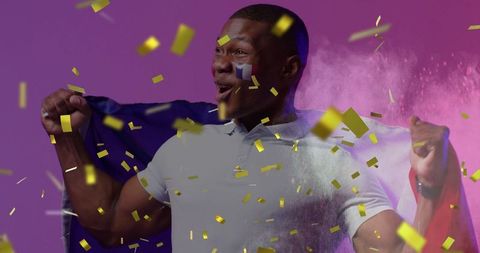 Joyful Supporter Celebrating French Victory Amidst Glittering Confetti