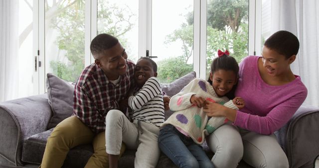 Happy Family Enjoying Time Together on Couch - Download Free Stock Images Pikwizard.com